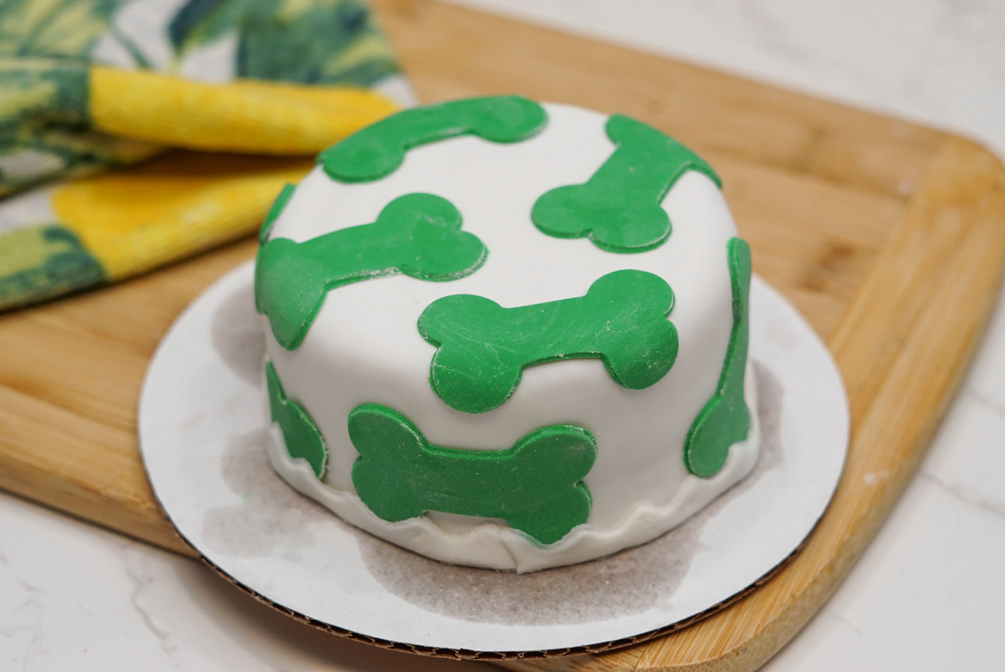 4-inch dog birthday cake with custom colored fondant bones, dog-safe birthday treat